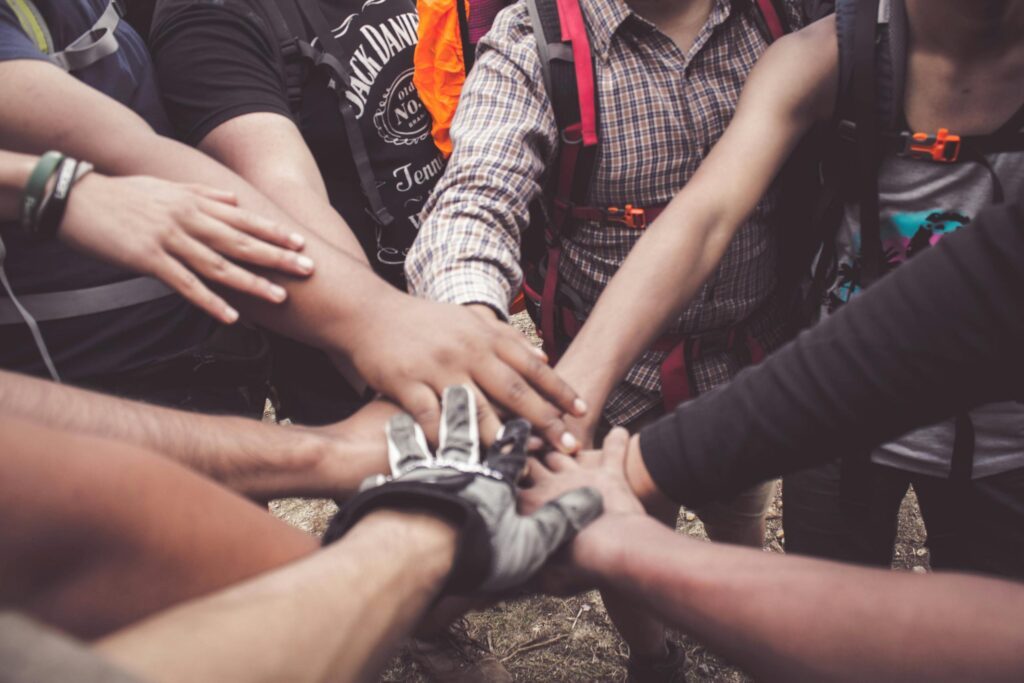 People Doing Group Hand Cheer - community