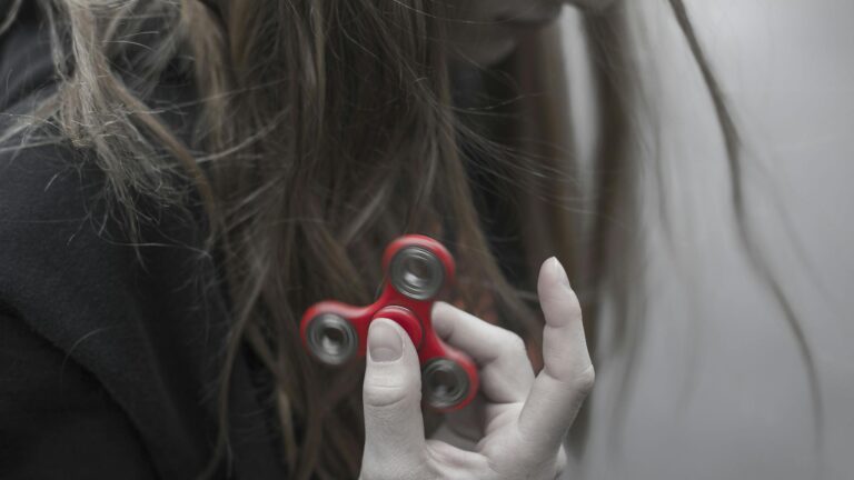 Social Media Marketing - Woman Holding Red Hand Spinner